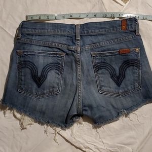 Custom cut distressed denim 7 shorts